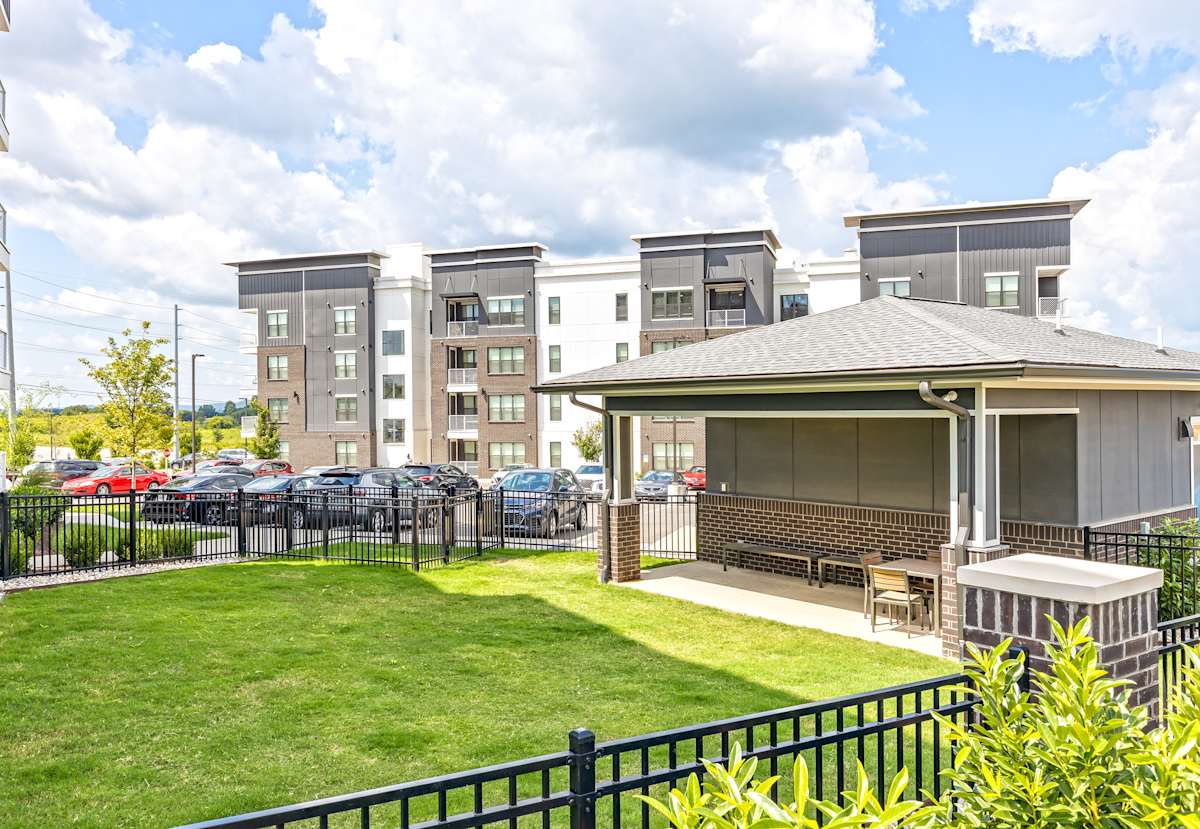 Vintage Century Farms Apartments dog park area with fenced lawn - Antioch, TN