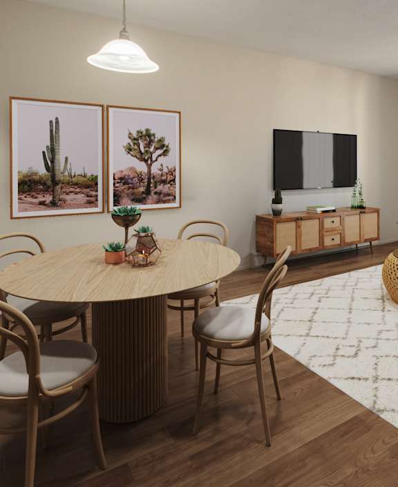 A living room with a white couch and a dining table.