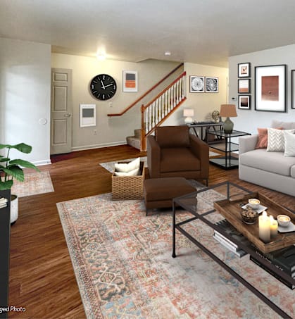 a living room with a couch and a chair and a table