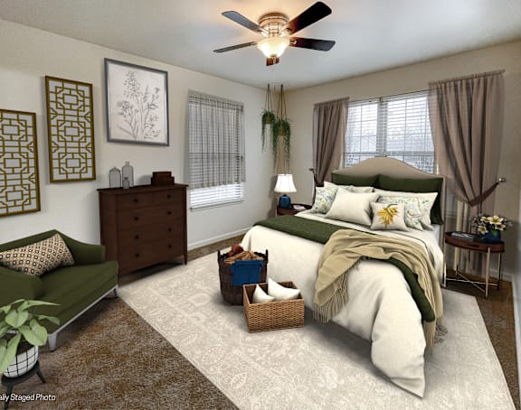 a bedroom with a bed and a ceiling fan