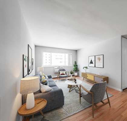 a living room with white walls and hardwood floors