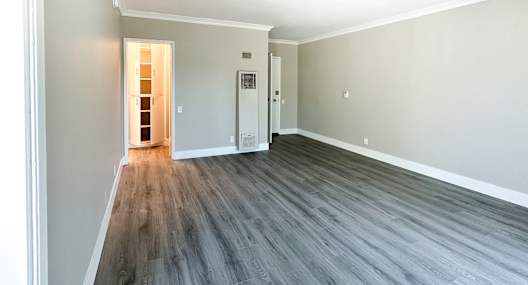 A room with a grey floor and white walls.