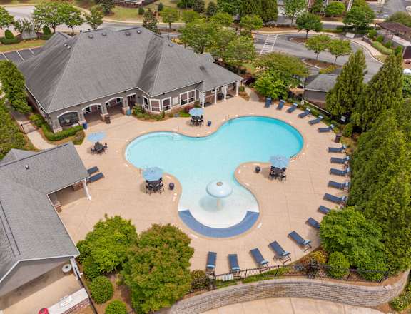 an aerial view of an outdoor swimming pool at a resort