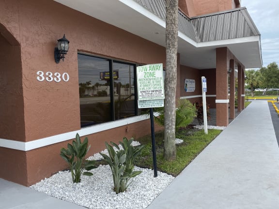 a sign in front of a building at Colonial Apartments, Orlando, FL 32808