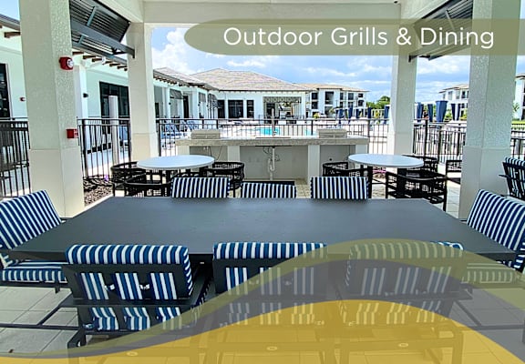 an outdoor dining area with tables and chairs and outside grill and dining