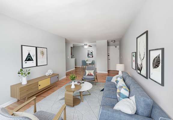 a living room with white walls and a blue couch