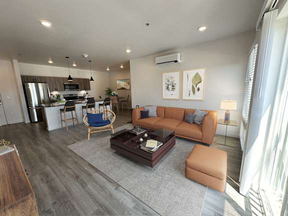 a living room with a couch and a table at Crosshatch, Garden City, ID, 83714