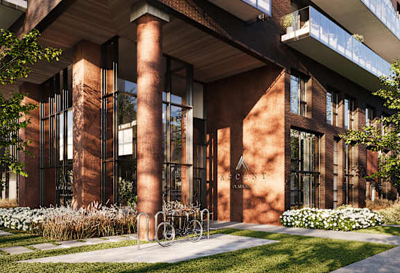 A modern building with a bicycle parked in front.