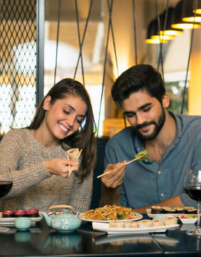 a couple eating at a restaurant