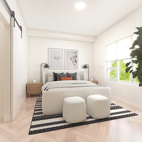 A modern bedroom with a large bed, two nightstands, and a large window.