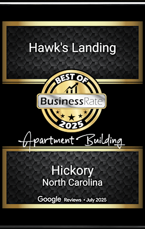 A framed award certificate for Hawk's Landing apartment building in Hickory, North Carolina.