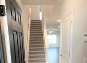 Thumbnail 16 of 60 - B2 (2-car) Entry with laminate wood flooring looking toward staircase