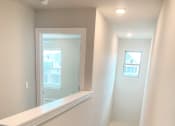 Thumbnail 38 of 60 - C1 (1-car) top of stairs looking down toward entry door