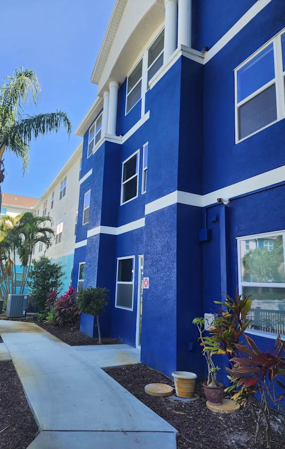 A blue and white striped awning over a building.