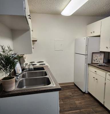 an abandoned office with a plant on the desk