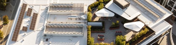 an aerial view of a building with balconies and a courtyard