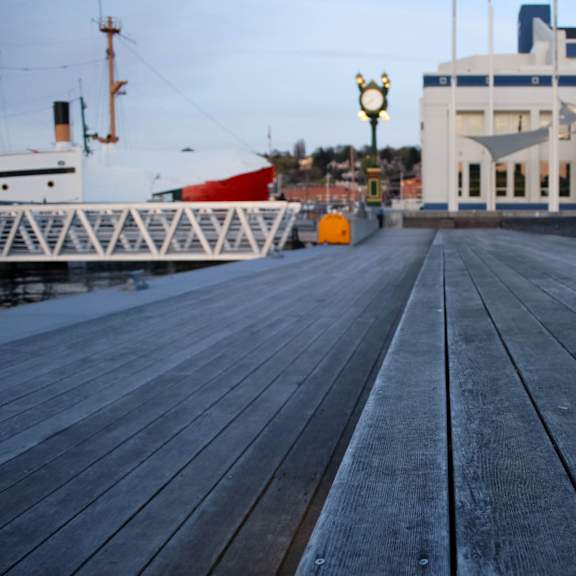 A wooden walkway leads to a building with a sign that says "Museum of History".