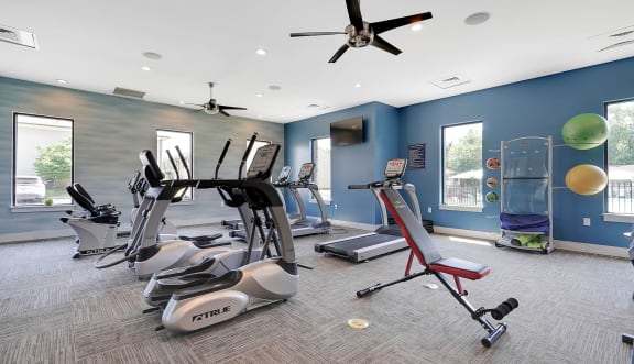 a gym with treadmills and other exercise equipment at Enclave at Breckenridge Apartments, Louisville, KY