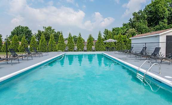 the pool at the whispering winds apartments in pearland, tx