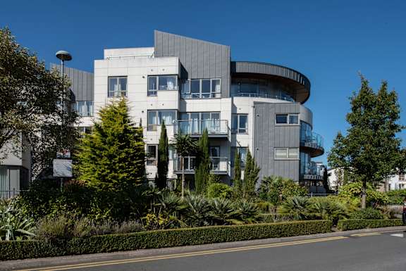 a large building with a street in front of it