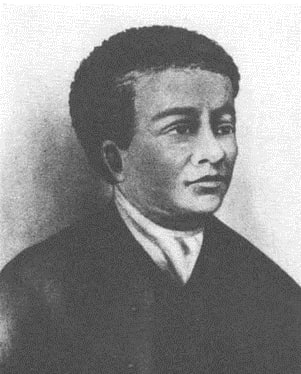 a black and white photo of a man in a suit