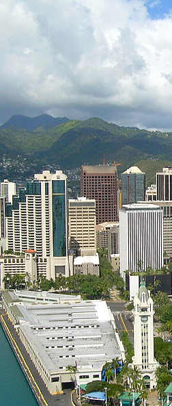 an aerial view of the city of wellington and the harbour with a cruise ship in the