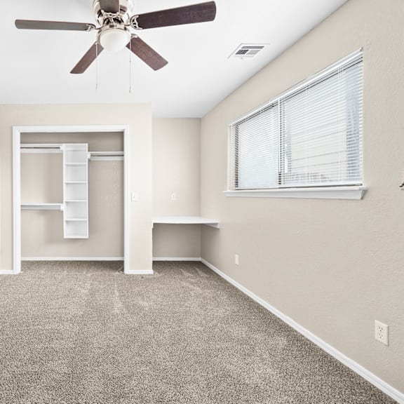 an open concept living room and dining area with a white dining table and rattan chairs