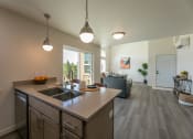 Thumbnail 3 of 10 - Kitchen Island With Pendent Lights at River Landing at Mirabeau, Spokane Valley, WA, Washington