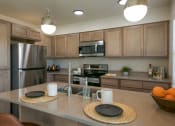 Thumbnail 4 of 10 - Fully Equipped Kitchen With Modern Appliances at River Landing at Mirabeau, Spokane Valley, WA, Washington, 99216