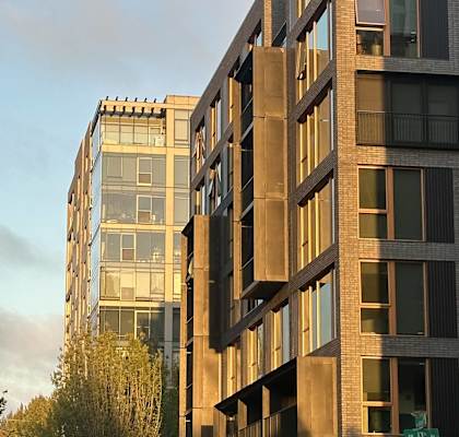 A tall building with many windows is shown in the image.