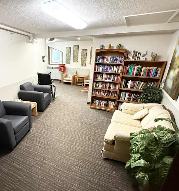 a bedroom with a bed and a ceiling fan