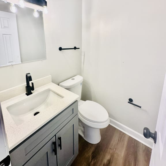 an empty bathroom with a sink and a toilet