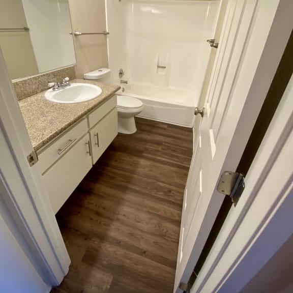 a small bathroom with a sink toilet and bathtub