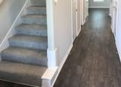 Thumbnail 34 of 60 - C1 (1-car) Entry with laminate wood flooring and staircase
