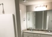 Thumbnail 40 of 60 - C1 (1-car) Master Bath with double sink, tile flooring, and shower