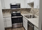 Thumbnail 21 of 45 - kitchen with stainless steal appliances