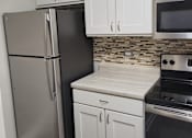 Thumbnail 22 of 45 - kitchen with stainless steal appliances
