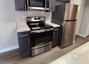 Thumbnail 5 of 48 - Rehabbed kitchen with stainless steel appliances