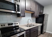 Thumbnail 22 of 48 - Glass backsplash and stainless steel appliances