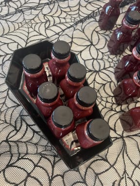 a tray of hot sauce bottles on a table
