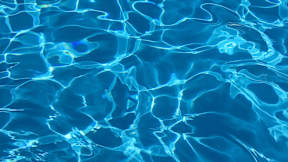 A close up view of the ripples in a swimming pool.