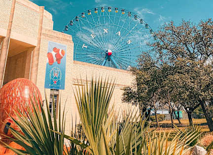 A Ferris wheel with a blue sky in the background.