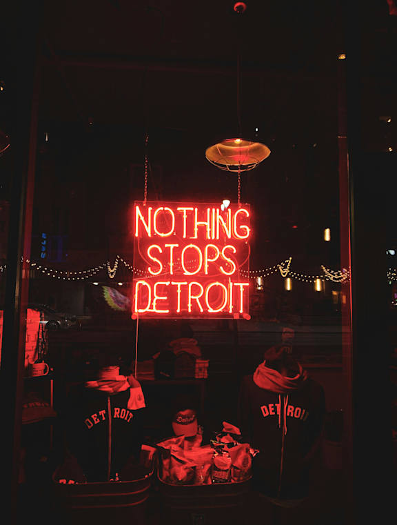 A neon sign that says Nothing Stops Detroit.