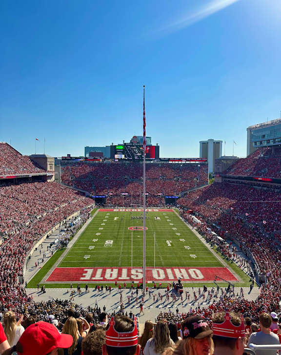 A football stadium is packed with fans watching a game at River View at Bexley Apartments, Columbus, OH