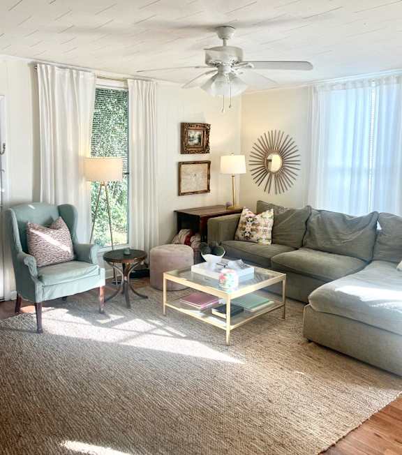 a living room with a couch and a table