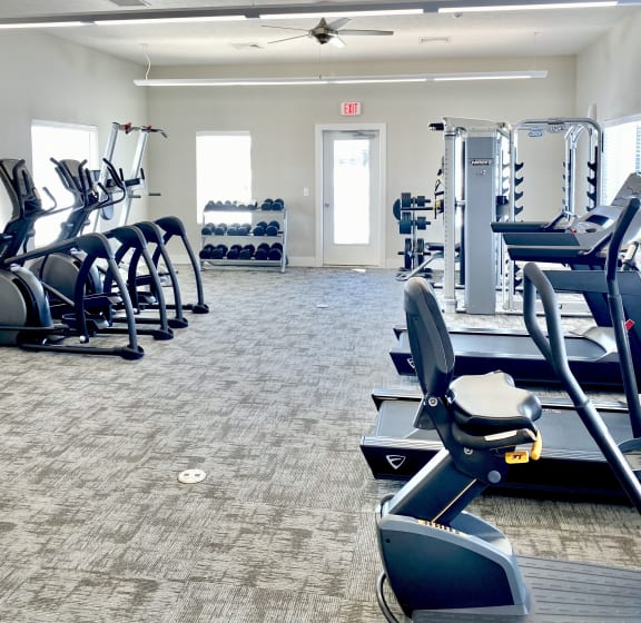a fitness center with cardio equipment and exercise machines