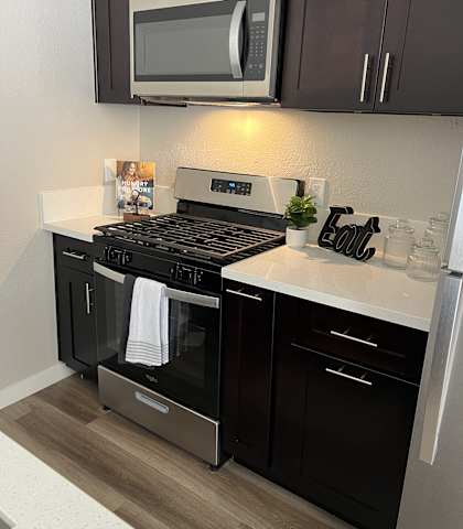 a kitchen with a stove and a microwave