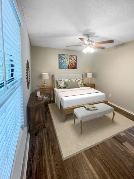 a bedroom with a bed and a ceiling fan at The Junction, Memphis, TN