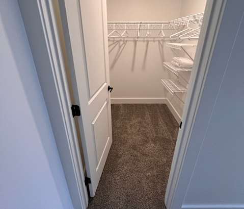 a basketball hoop hangs in the corner of a room