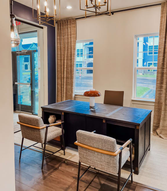 a conference room with a desk and chairs and a large window at Hamilton Reserve, Greensboro, 27407